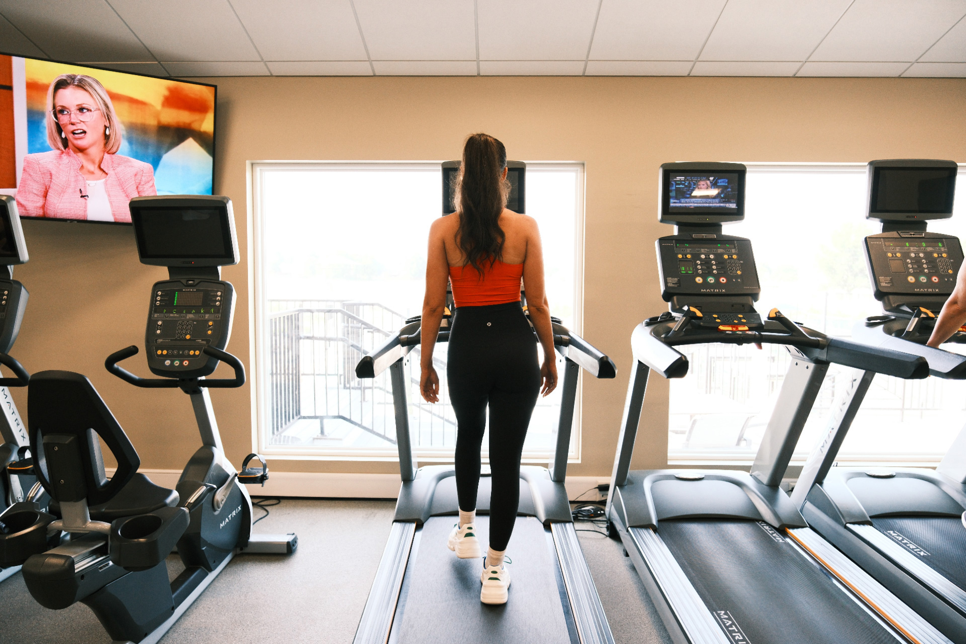 Woman-on-gym-treadmill-workout-fitness-health-Club-at-Forest-Ridge